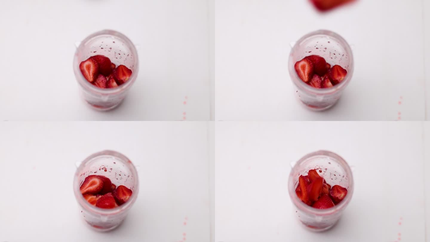 开放式厨房操作台上陈列多瓶调配好的草莓香蕉牛奶样品,旁边放置量具、搅拌棒和手写标签,展示家庭批量制作场景 厨房台面上摆放多个玻璃罐,分别盛放不同颜色的果奶混合物,配有量杯、搅拌棒和标签纸