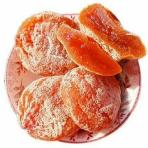 富平柿饼好的富平柿饼应该是酱紫的：外观饱满，柿霜多，