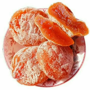 富平柿饼好的富平柿饼应该是酱紫的：外观饱满，柿霜多，