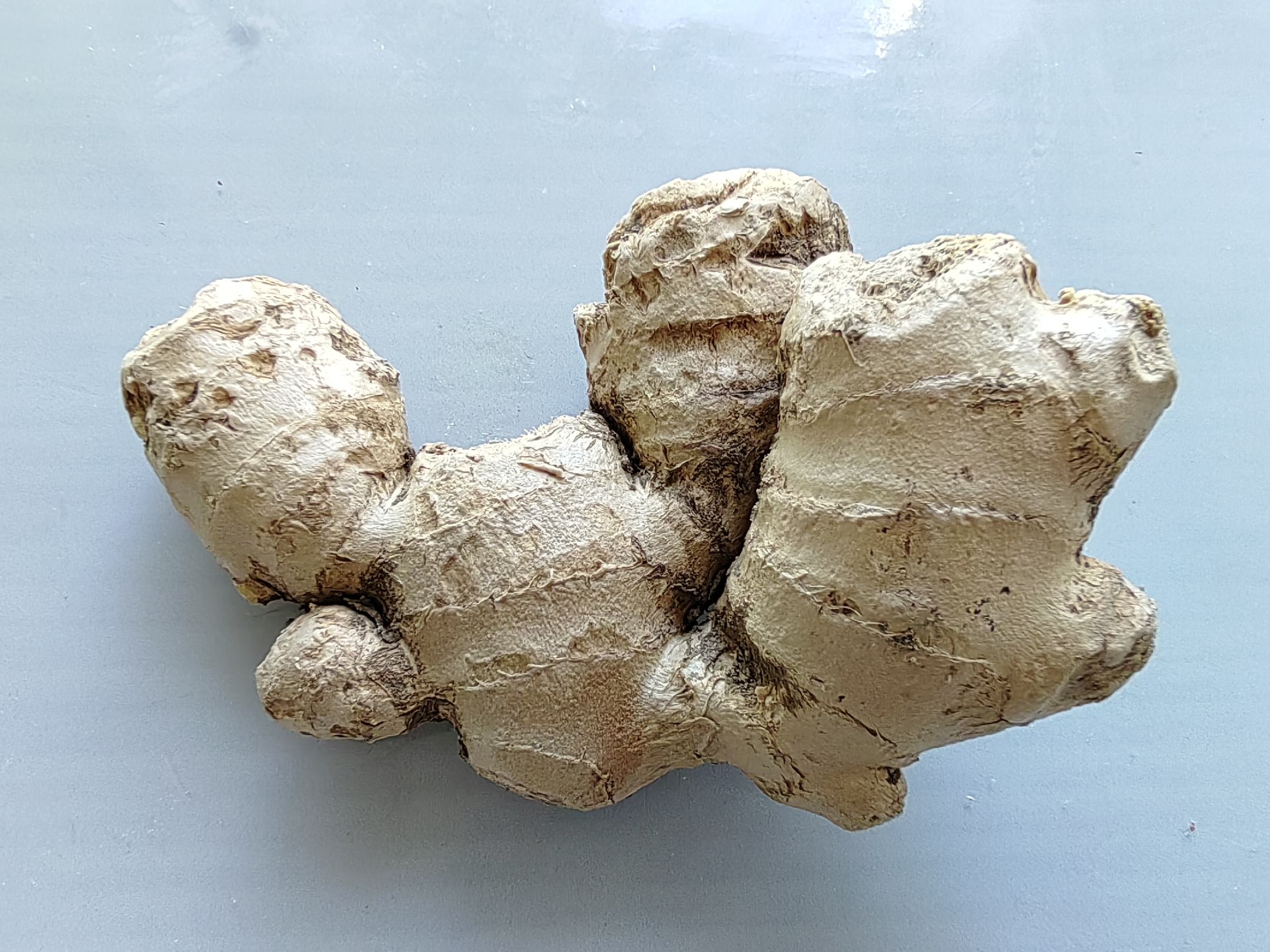 图示展示了生姜中毒后常见的身体不适部位,包括胃部灼热、喉咙刺痛、头晕等症状的分布图 生姜中毒症状示意图