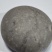 狗宝石1个，扁圆形，直径55mm，重约133.3克