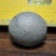 狗宝石1个，扁圆形，直径55mm，重约133.3克
