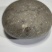 狗宝石1个，扁圆形，直径55mm，重约133.3克